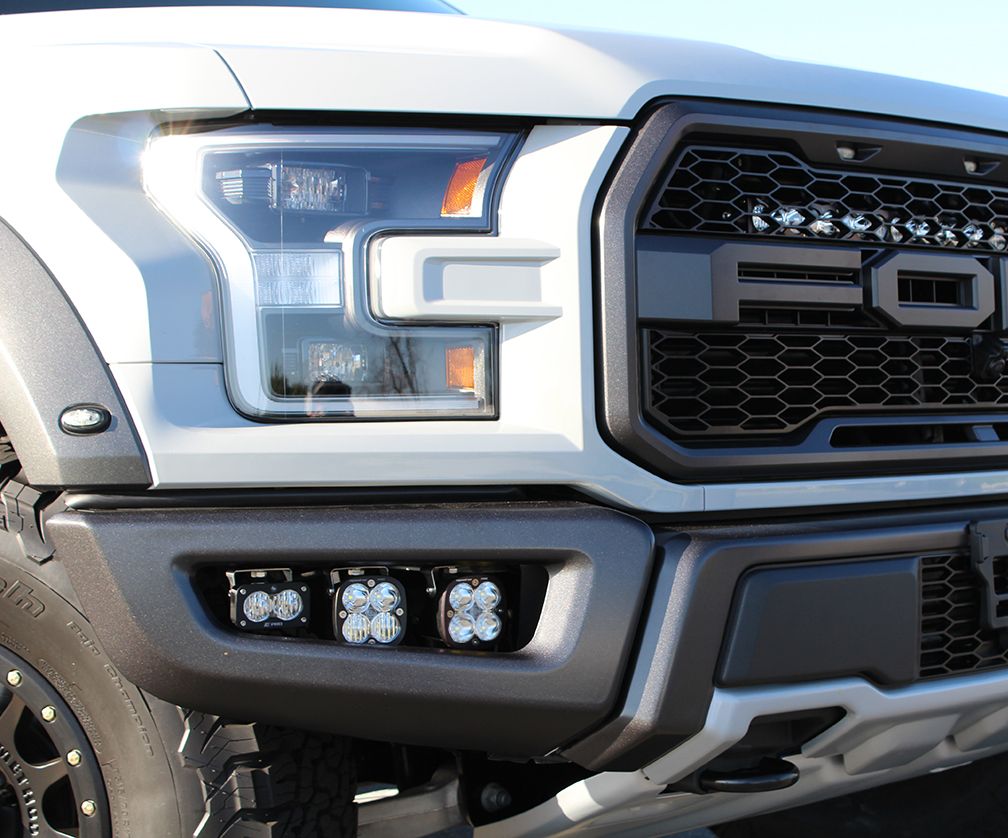 2017-2019 Baja POD fog lights shown in a White Raptor controlled by auxiliary switches in the Raptor