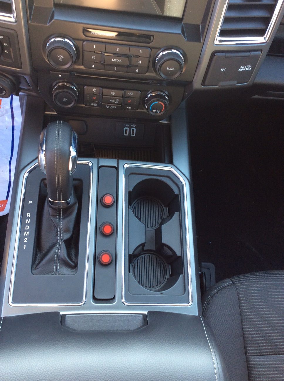 RED TOGGLE SWITCHES SHOWN IN A SOLID TOP F-150 AUXILIARY SWITCH PANEL